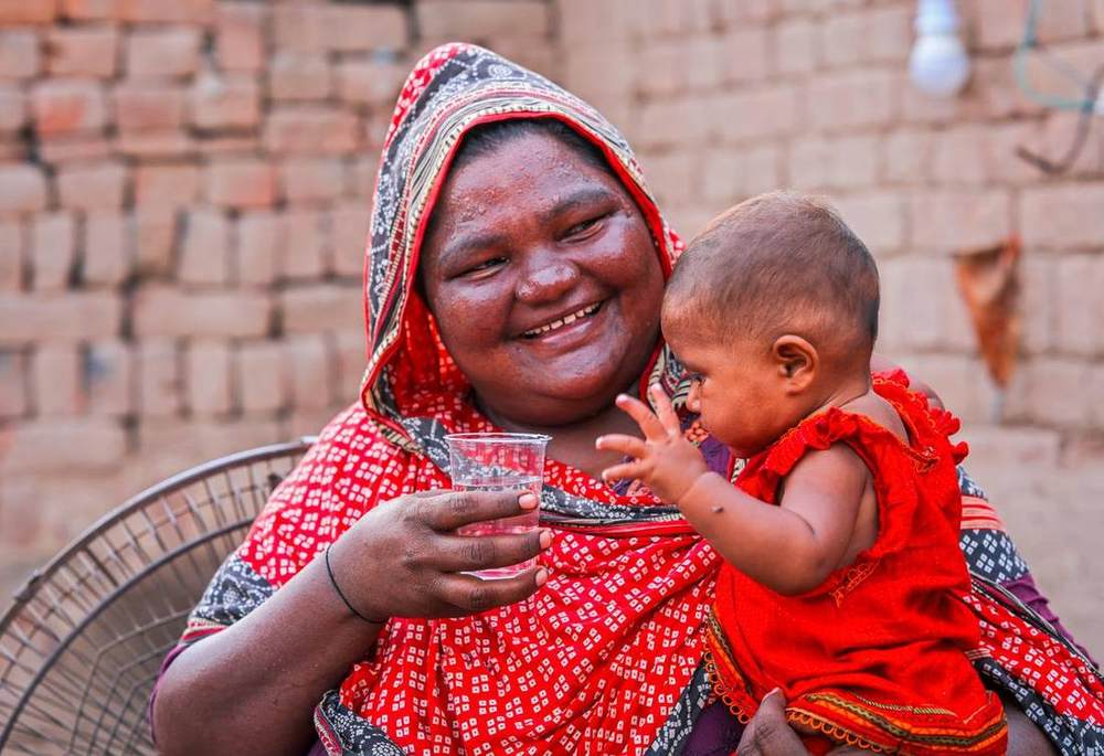 A water filter handed over to a family at a brick kiln